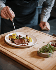 Picture of chef making a plate of food